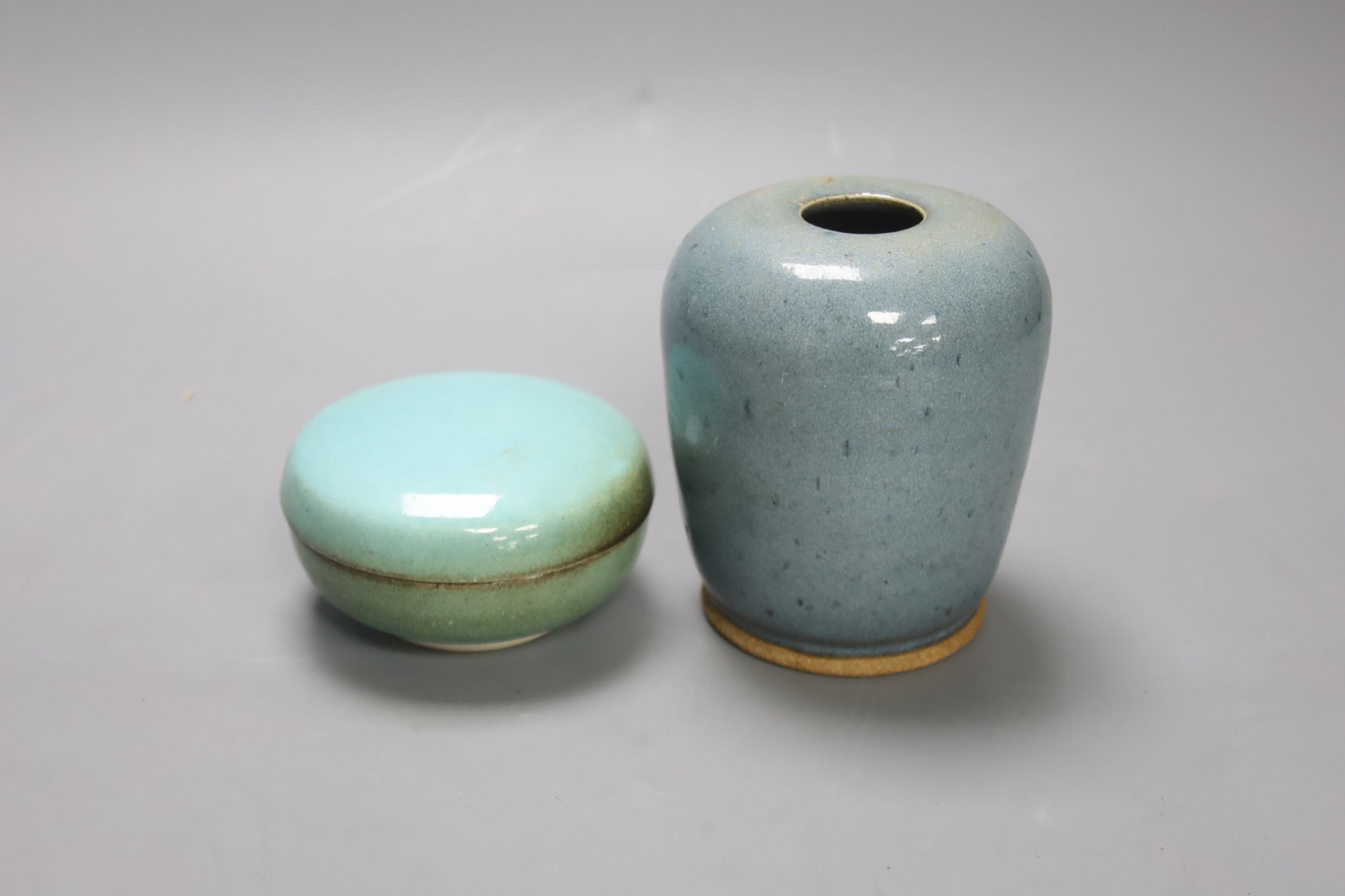 A robin’s-egg glazed Studio pottery vase, height 11.5cm, and a box